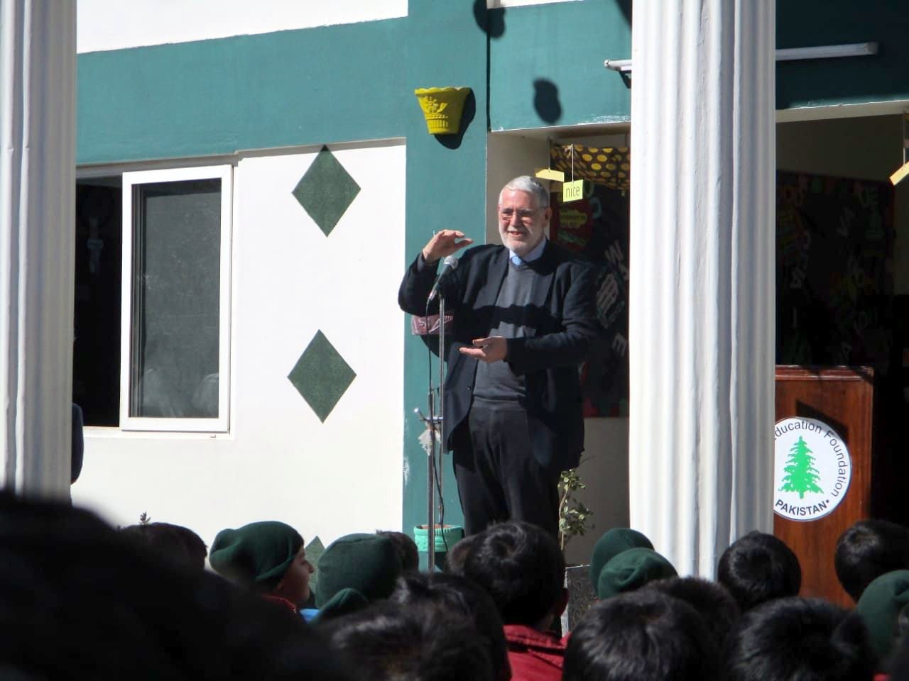 Sir David Green addresses a school assembly, November 2018 Our patron speaks to pupils at a school assembly from a podium with the KEF logo
