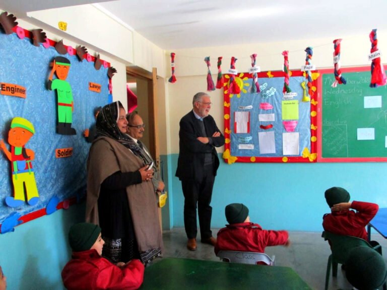 Young pupils take part in an English lesson about prepositions